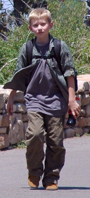 Typical tourist today with a bottle of soft drink.